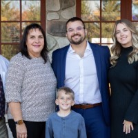 Alex Hogarth poses with family